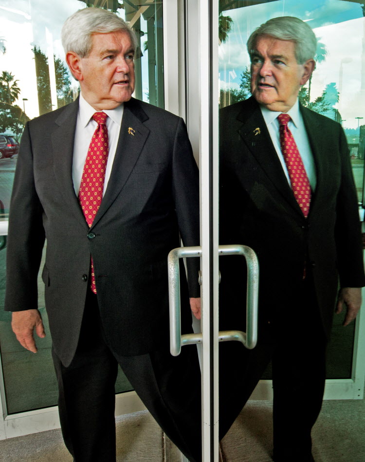 DOUBLE TROUBLE: Newt Gingrich takes a moment to reflect on his soaring poll numbers yesterday as he heads for a speech in Tampa. DOUBLE TROUBLE: Newt Gingrich takes a moment to reflect on his soaring poll numbers yesterday as he heads for a speech in Tampa.